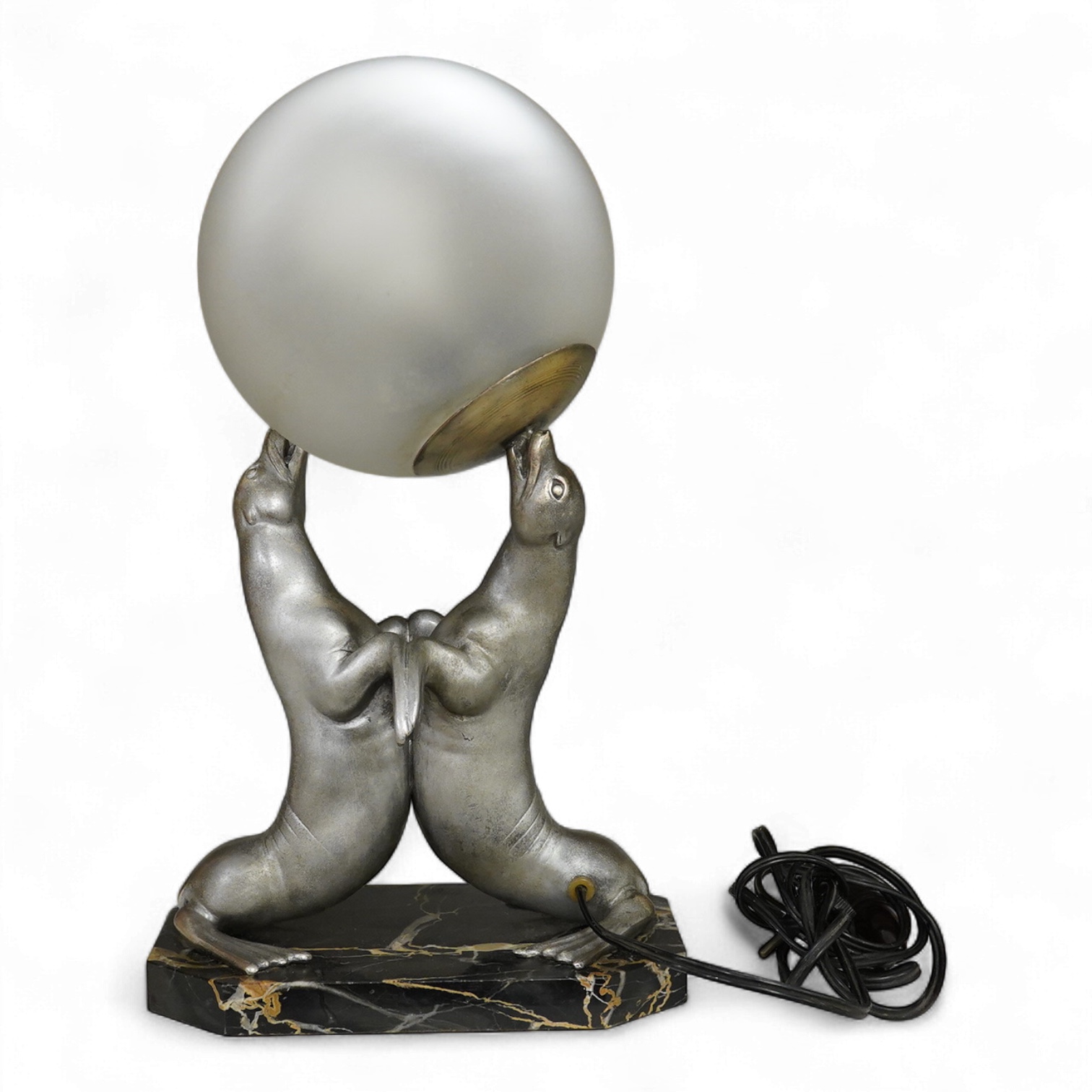 After Louis Carvin (French, 1875-1951) a twin seal lamp with circular frosted glass shade, 34cm high